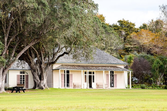 Bay of Islands Heritage Experience from Auckland incl. Waitangi & Russell - Paihia boat time: dolphins, remote bays, and Cape Brett Lighthouse views