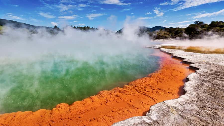 Ex Auckland: TRIPLE DEAL Wai-O-Tapu, Redwood & Blue Springs - Lady Knox Geyser at 10:15 AM: the payoff moment you plan around